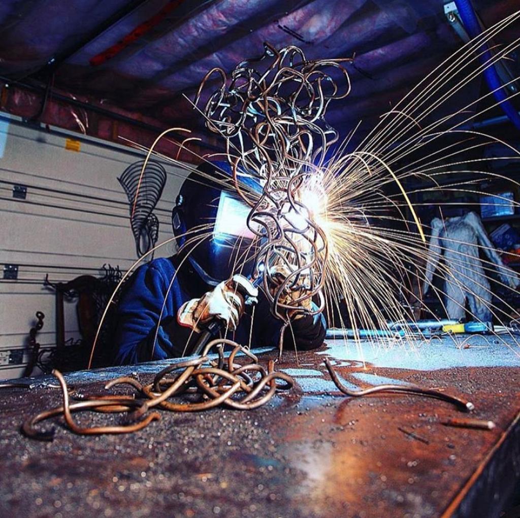 Erika Myers welding in studio