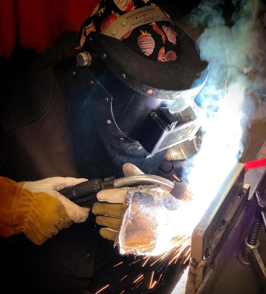 Close up of Erika Myers welding